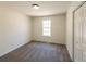 This bedroom features a window, new floors and neutral paint at 2192 Stenger Rd, Douglasville, GA 30135