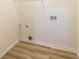 Small closet with laminate flooring and ready for washer-dryer hookups at 2192 Stenger Rd, Douglasville, GA 30135