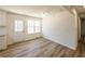 Bright dining area features new wood floors, white walls, and a door to the exterior at 2192 Stenger Rd, Douglasville, GA 30135
