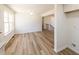 The dining room features new floors, white walls and a stair case at 2192 Stenger Rd, Douglasville, GA 30135