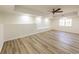 Open concept living room with laminate flooring, recessed lighting, and plenty of natural light at 2192 Stenger Rd, Douglasville, GA 30135
