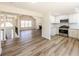 Open-concept living space with modern kitchen, fireplace, and beautiful flooring at 2192 Stenger Rd, Douglasville, GA 30135