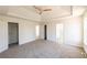Spacious main bedroom featuring a ceiling fan, neutral color palette, and walk-in closet at 2192 Stenger Rd, Douglasville, GA 30135