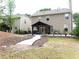Expansive backyard featuring a charming pergola, a concrete path, and a well-maintained lawn, ideal for outdoor relaxation at 3442 Old Towne Ln, Cumming, GA 30040