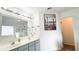 Bathroom boasts dual sinks, shower, a large mirror, and stylish fixtures at 3442 Old Towne Ln, Cumming, GA 30040