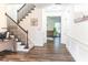 Welcoming entryway features hardwood flooring, an adjacent office area, and staircase at 3442 Old Towne Ln, Cumming, GA 30040