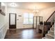 Inviting foyer with hardwood floors, office space, and staircase access at 3442 Old Towne Ln, Cumming, GA 30040