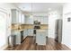 Modern kitchen features stainless steel appliances, an island, granite countertops, and light blue cabinets at 3442 Old Towne Ln, Cumming, GA 30040