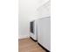 Bright laundry area featuring modern washer and dryer, plus convenient wire shelving for storage at 3442 Old Towne Ln, Cumming, GA 30040