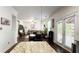 Open floorplan with kitchen island, living room with large sectional, and doors to outdoor space at 3442 Old Towne Ln, Cumming, GA 30040