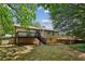 Home back exterior featuring a large deck overlooking the yard, perfect for outdoor entertainment and relaxation at 4192 Alaina Cir, Austell, GA 30106