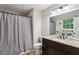 Bathroom features granite vanity, toilet and shower with a shower curtain at 4192 Alaina Cir, Austell, GA 30106