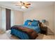 This bedroom features carpet, neutral walls, ceiling fan and two windows at 4192 Alaina Cir, Austell, GA 30106