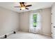 Neutral bedroom featuring a ceiling fan, natural light, and an open space for fitness at 4192 Alaina Cir, Austell, GA 30106
