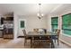 Functional dining area with a table set, view to the outside, and easy access to the kitchen area at 4192 Alaina Cir, Austell, GA 30106