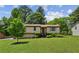 Charming home with a well-manicured lawn and mature landscaping, creating a welcoming curb appeal at 4192 Alaina Cir, Austell, GA 30106