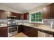 The updated kitchen features a gas cooktop and stainless steel appliances at 4192 Alaina Cir, Austell, GA 30106