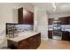 The eat-in kitchen features stainless appliances, tile backsplash and granite countertops at 4192 Alaina Cir, Austell, GA 30106