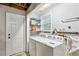 Laundry room with side by side washer and dryer and storage shelves at 4192 Alaina Cir, Austell, GA 30106