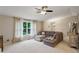 Spacious living area with a large sectional sofa, neutral tones, and a view of the outdoors at 4192 Alaina Cir, Austell, GA 30106