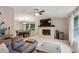 Bright living room with a fireplace feature, seamlessly flowing into the dining area, perfect for Gathering gatherings at 4192 Alaina Cir, Austell, GA 30106
