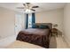 Main bedroom with neutral walls, ceiling fan, carpet, and two windows at 4192 Alaina Cir, Austell, GA 30106
