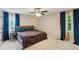 Spacious main bedroom with plush carpet, ceiling fan and ensuite bathroom at 4192 Alaina Cir, Austell, GA 30106