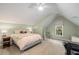 Spacious bedroom features a window with shade and chair at 626 Kimberly Ne Ln, Atlanta, GA 30306