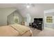 Comfortable bedroom with a home office setup, including dual monitors and a rolling chair at 626 Kimberly Ne Ln, Atlanta, GA 30306