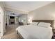 Cozy bedroom with a view into a living area featuring a stone fireplace and a comfortable workspace at 626 Kimberly Ne Ln, Atlanta, GA 30306