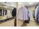 Walk-in closet featuring ample shelving, racks, and carpeted floors for organized storage at 626 Kimberly Ne Ln, Atlanta, GA 30306