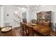 Elegant dining room with hardwood floors, chandelier, and views of the staircase at 626 Kimberly Ne Ln, Atlanta, GA 30306