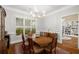 Bright dining room with hardwood floors, chandelier, and seamless access to a cozy library at 626 Kimberly Ne Ln, Atlanta, GA 30306