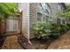 Exterior of a home featuring a stone pathway, shingle siding, and well-maintained landscaping at 626 Kimberly Ne Ln, Atlanta, GA 30306