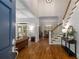 View into foyer featuring hardwood floors, staircase, and an open layout to the living and dining areas at 626 Kimberly Ne Ln, Atlanta, GA 30306