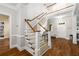 Bright foyer with staircase, hardwood floors and wainscoting at 626 Kimberly Ne Ln, Atlanta, GA 30306