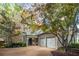 Charming two-story home featuring a stone chimney, inviting entryway, and two-car garage at 626 Kimberly Ne Ln, Atlanta, GA 30306