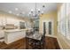Open concept kitchen features an island, stainless steel appliances, and a view to the breakfast area at 626 Kimberly Ne Ln, Atlanta, GA 30306