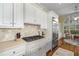 Kitchen features stainless steel refrigerator, gas cooktop, tile backsplash and lots of natural light at 626 Kimberly Ne Ln, Atlanta, GA 30306