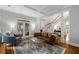 Bright and airy living room with hardwood floors, coffered ceilings, and access to an outdoor space at 626 Kimberly Ne Ln, Atlanta, GA 30306