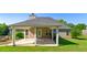 Covered back patio perfect for entertaining or relaxing, complete with ample seating space at 1625 Alcovy River Dr, Dacula, GA 30019