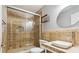 Bathroom with glass enclosed shower and granite topped vanity at 1625 Alcovy River Dr, Dacula, GA 30019