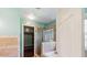 Bathroom with tile shower, soaking tub, wood-look floor, and custom walk-in closet at 1625 Alcovy River Dr, Dacula, GA 30019