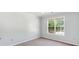 A standard bedroom view with neutral walls and carpet at 1625 Alcovy River Dr, Dacula, GA 30019