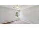 Bedroom with neutral carpeting, light gray walls and a bright window at 1625 Alcovy River Dr, Dacula, GA 30019