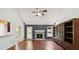 Spacious living room featuring vaulted ceilings, hardwood floors, and a stone fireplace at 1625 Alcovy River Dr, Dacula, GA 30019