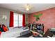 Themed bedroom with red accents, a bed, and a brick accent wall at 190 Country Club Dr, Hiram, GA 30141