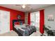 Bedroom featuring red accents, a window, and a black drum set at 190 Country Club Dr, Hiram, GA 30141