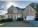 Inviting two-story home with a cozy porch and manicured landscaping at 190 Country Club Dr, Hiram, GA 30141