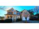 Beautiful two-story home with stone accents, a two-car garage, and manicured landscaping at 190 Country Club Dr, Hiram, GA 30141